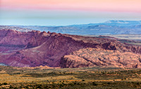 Vast desert landscape with colorful rock formations in Coconino