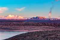 Industrial Power Plant in Desert Landscape at Sunset
