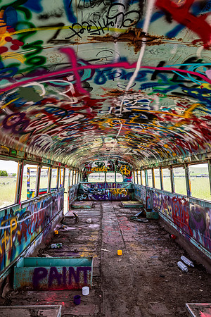 Abandoned Bus Interior Covered in Graffiti