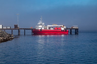 Red Vessel Docked at Pier