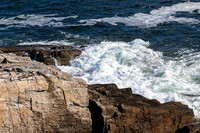 Ocean waves crashing on rocky coastline