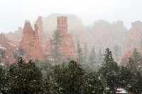 Winter Snowfall on Red Rock Formations