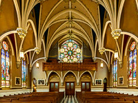 Historic Church Interior with Stained-Glass Windows