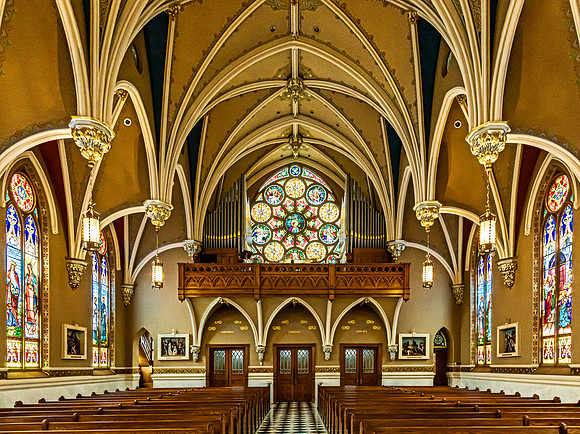 Historic Church Interior with Stained-Glass Windows