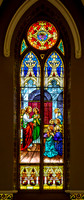 Stained Glass Window Depicting Jesus and Eucharist