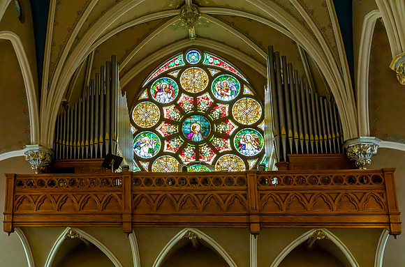 Stained Glass Window and Pipe Organ in Church
