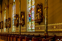 Church Interior with Stained Glass and Religious Sculptures
