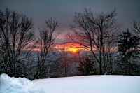 Winter Sunset Over Snowy Mountains