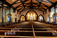 Historic Church Interior with Empty Pews