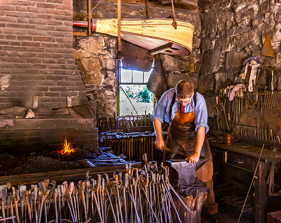 Blacksmith at Work in Traditional Forge