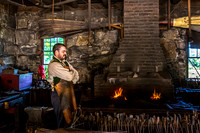 Blacksmith in Workshop with Roaring Forge