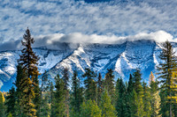 Snowy Mountains and Forest Landscape