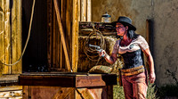 Woman in Western Attire with Revolver