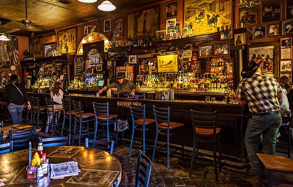 Old-Fashioned Bar Scene with Customers and Bartender