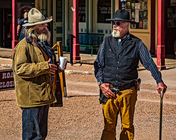 Two Men in Western Attire Talking