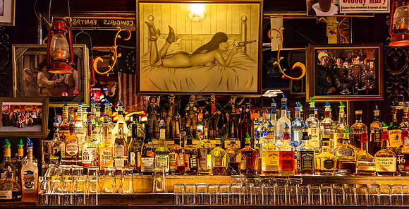 Well-stocked bar with various liquor bottles