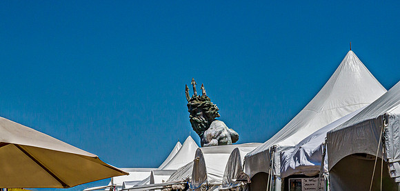 Head of Neptune Statue Above Tents