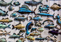 Colorful Ceramic Marine Life Decorations on Wood Wall