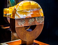 Modern Abstract Sculpture with Glowing Stone and Rusty Metal