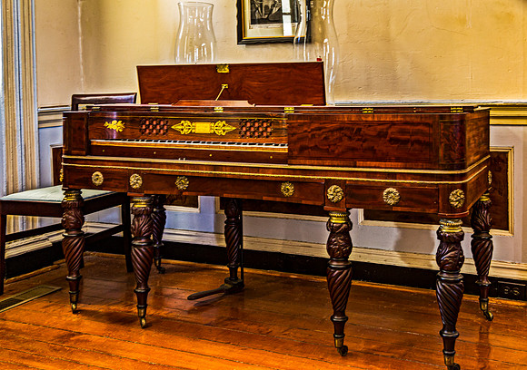 Antique Wooden Piano with Ornate Details