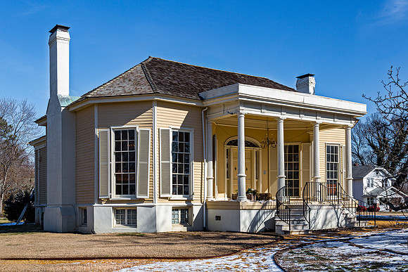 Historic House with White Pillars and Chimney