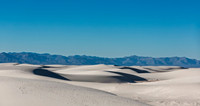 White Sand Dunes with Distant Mountains