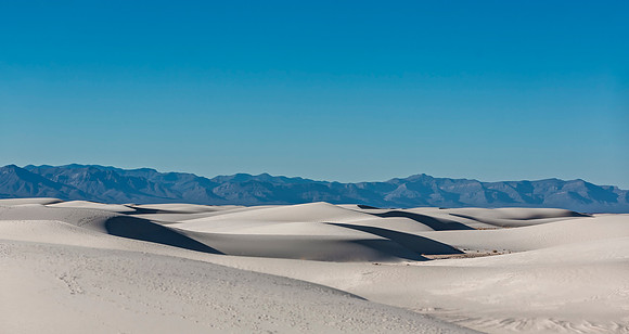White Sand Dunes with Distant Mountains