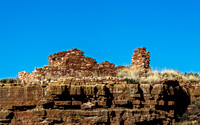 Ancient Stone Ruins on Cliff Under Blue Sky