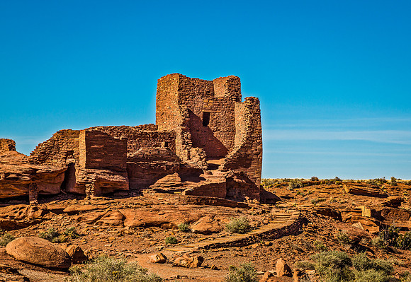 Ancient Wupatki Pueblo Ruins Against Blue Sky