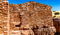 Ancient Stone Wall Ruins Against Blue Sky