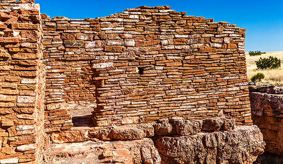 Ancient Stone Wall Ruins Against Blue Sky