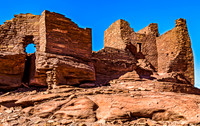 Ancient Red Stone Ruins Under Blue Sky