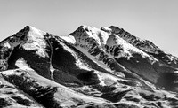 Snow-Capped Mountain Peaks with Forests and Foothills