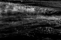 Steaming Geothermal Terrace with Mineral Deposits