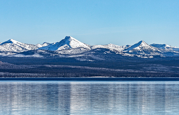 Snowy Mountains Reflected in Calm Lake