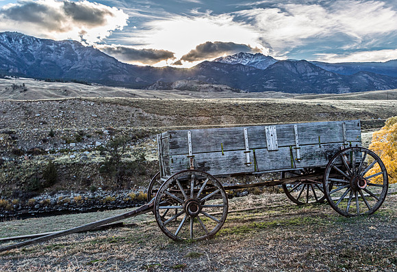 Old Wooden Wagon in Mountainous Landscape