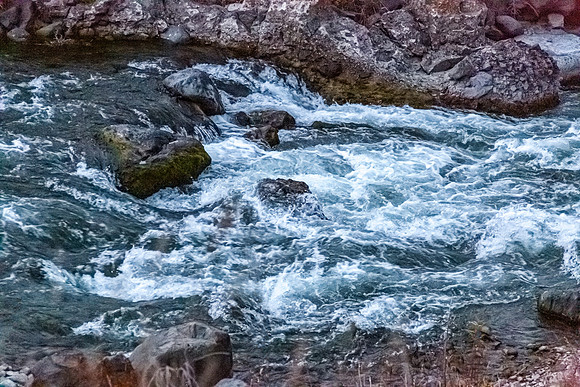 Turbulent River Flowing Over Rocks