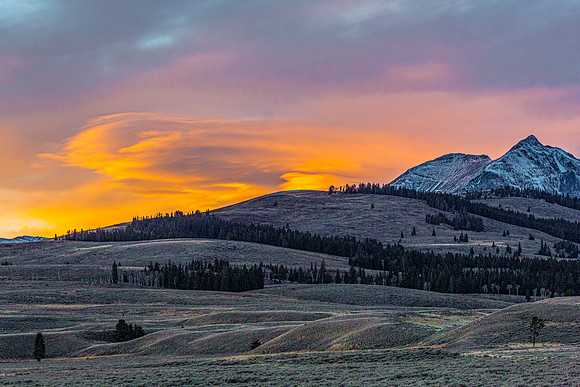 Sunset over Mountains and Rolling Hills