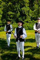 Young Males in Colonial Attire at Outdoor Reenactment