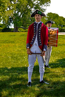 Colonial Era Military Reenactors in Grassy Field