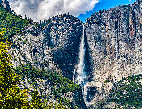 Majestic Waterfall Cascading Down Granite Cliff