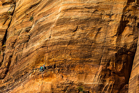 Climbers on Sandstone Cliff