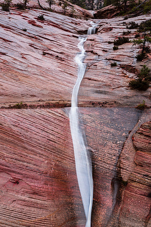 Waterfall on Sandstone Cliff