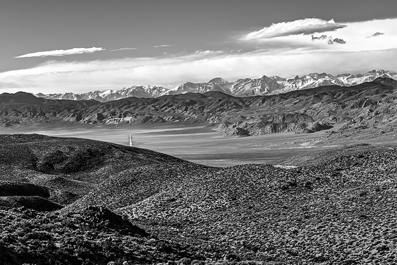 Desert Landscape with Snow-Capped Mountains