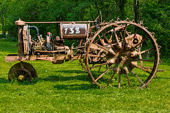 Rusty Antique Tractor in Field
