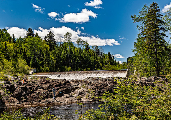 River Dam and Forest Landscape