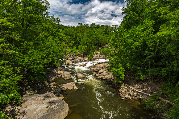 River Flowing Through Rocky Gorge